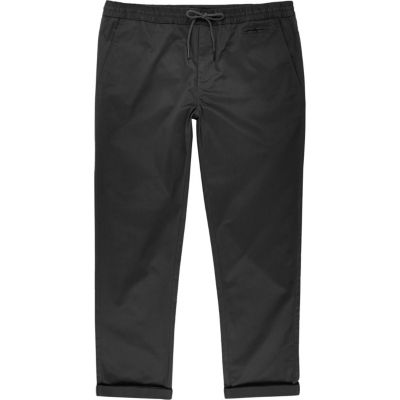 Dark green pull on trousers